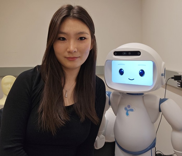 Soomin Shin with a QTrobot